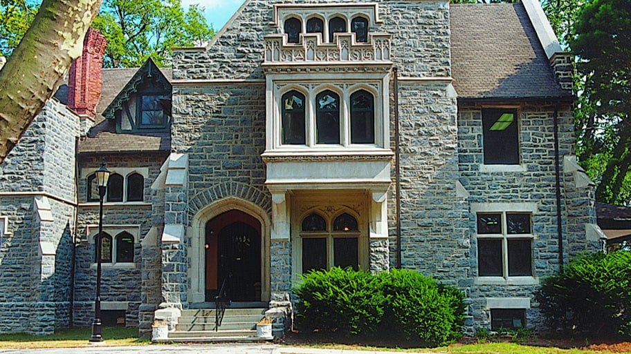brick home with gothic windows and doors