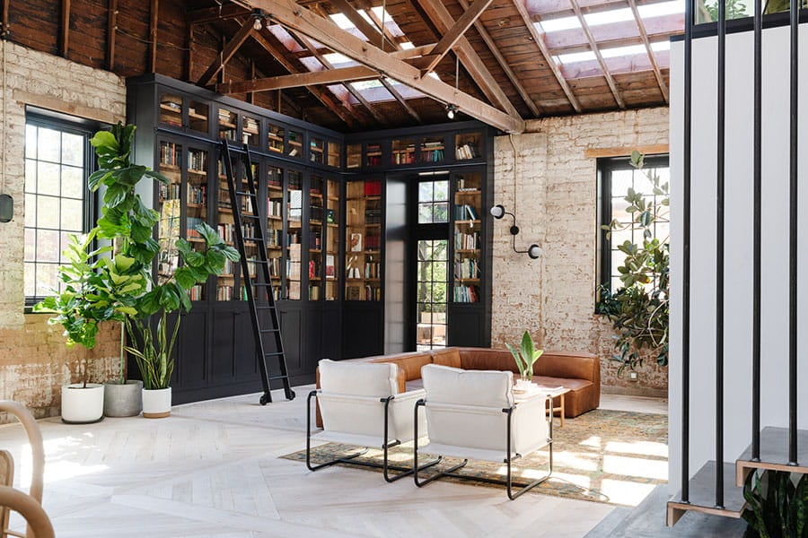 interior of brick house with natural light coming through black framed andersen windows